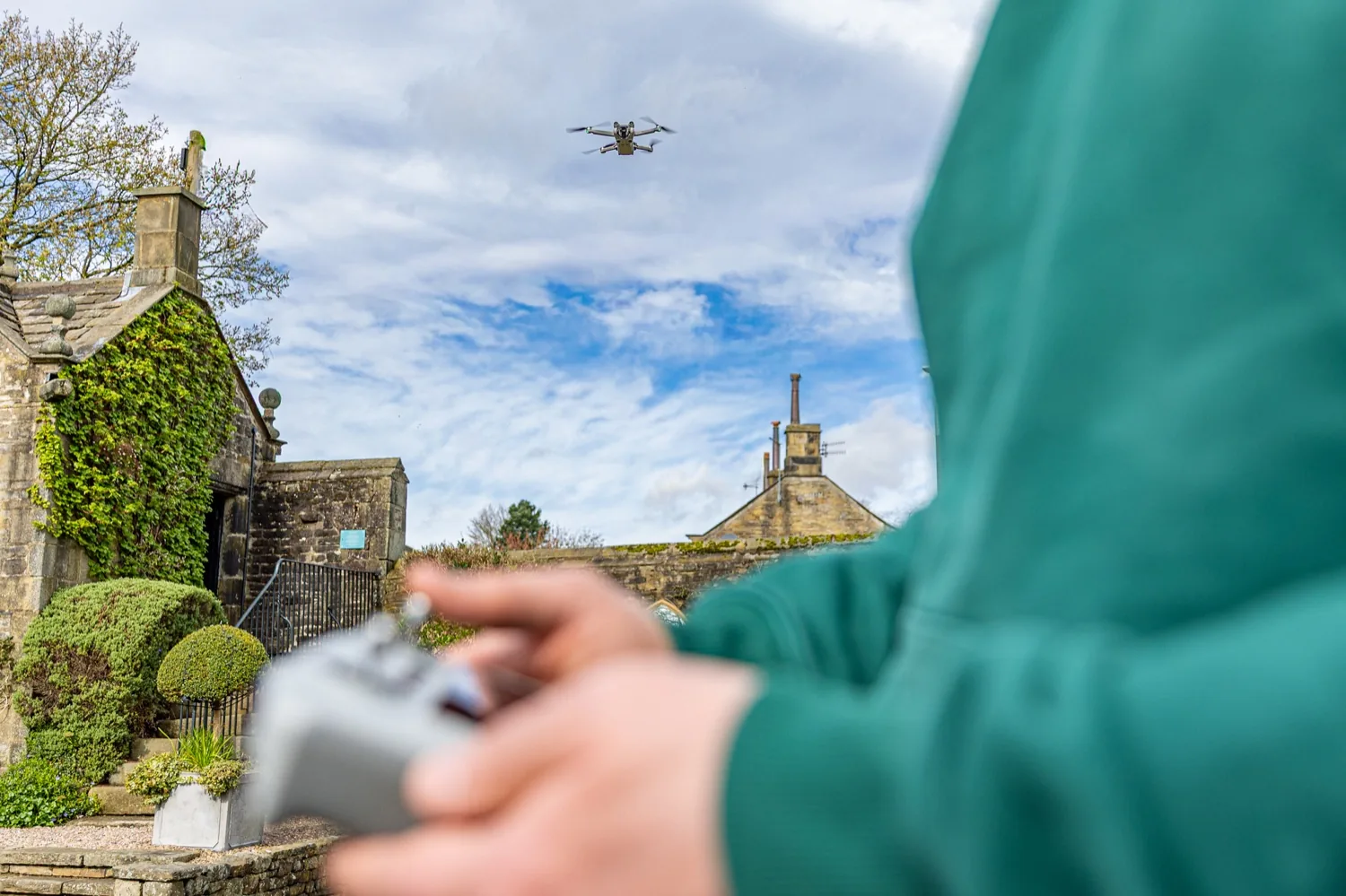 Halizona flying the drone over a client’s stone building in Yorkshire